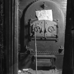 A crime photo of the furnace where James Mitchell crammed and burned Lillian's dead body. Crime photo of the furnace