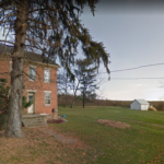 This is an old home in the Latimore area that is similar to that which was in the event: a brick house, a shed, a wooded area, a back road. Home in Latimore area
