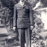 Robert Duckworth in WWII uniform with his happy dog in the background. Robert Duckworth in WWII uniform.