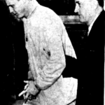 Wells after his arrest in 1961. He would have escaped arrest, but he made a mistake by paying $1,000 cash in $20's for a brand new VW bus. The serial numbers on the 20's were quickly traced back to the VW sale. Wells after his arrest in 1961.