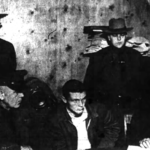 Wells Jr. taken in for questioning in Hawthorne, NY for arson and murder. He changed his story three times (1955). Wells Jr. taken in for questioning 1955